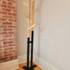 ree standing coat rack with modern industrial look: black base with wooden top consisting of angled arms