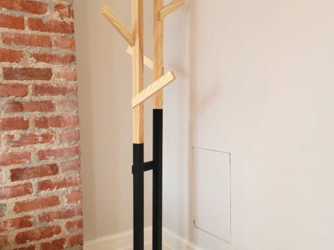 ree standing coat rack with modern industrial look: black base with wooden top consisting of angled arms
